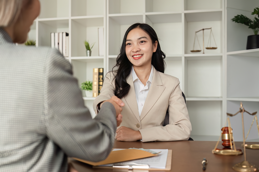 Payment Plans. Two people shaking hands in agreement.