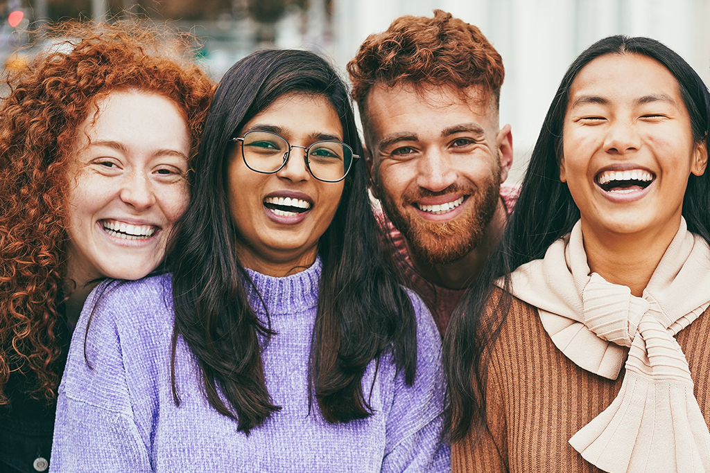 Group of diverse young people smiling at the camera